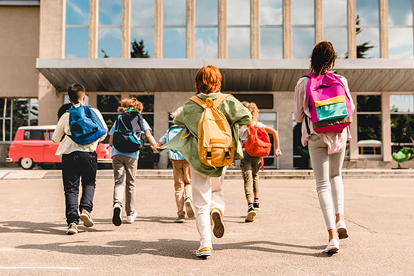 Children with backpacks on a field trip