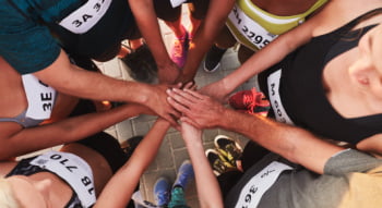 team members put their hands in before starting a match